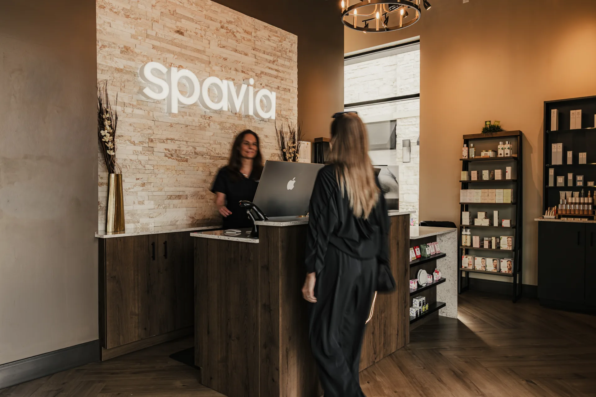 A Spavia team member welcomes a guest at reception